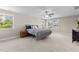 Well-lit bedroom with plush carpeting and a queen-size bed; bright and welcoming space at 2120 Rainy Lake St, Wake Forest, NC 27587