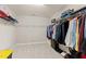 Walk-in closet with upper shelf and ample hanging storage for clothing at 2120 Rainy Lake St, Wake Forest, NC 27587
