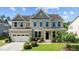Charming two-story home featuring manicured landscaping and a welcoming front porch at 2120 Rainy Lake St, Wake Forest, NC 27587
