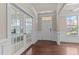 Elegant foyer with hardwood floors and french doors, offering a grand entrance at 2120 Rainy Lake St, Wake Forest, NC 27587