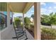 Cozy front porch with rocking chairs and a view of the serene neighborhood at 2120 Rainy Lake St, Wake Forest, NC 27587