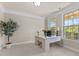 Inviting home office space with large windows and a view of the outdoors at 2120 Rainy Lake St, Wake Forest, NC 27587