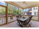 Relaxing screened-in patio with a table, seating, and views of the yard at 2120 Rainy Lake St, Wake Forest, NC 27587