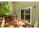 A lovely back deck provides a serene outdoor retreat with peaceful and private backyard views at 219 W Columbia Pl, Chapel Hill, NC 27516