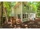 Charming backyard with a wooden deck, surrounded by lush trees and natural beauty at 219 W Columbia Pl, Chapel Hill, NC 27516