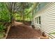 Green backyard featuring a well-maintained lawn, mature trees, and partial fencing for privacy at 219 W Columbia Pl, Chapel Hill, NC 27516