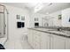 Well-lit bathroom featuring a double vanity and a glass shower at 219 W Columbia Pl, Chapel Hill, NC 27516