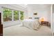 Well-lit bedroom with a large window offering serene outdoor views at 219 W Columbia Pl, Chapel Hill, NC 27516