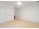 Large bedroom with double closets and carpet flooring, creating a serene and inviting atmosphere at 219 W Columbia Pl, Chapel Hill, NC 27516