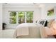 Bright bedroom featuring a large window and neutral decor at 219 W Columbia Pl, Chapel Hill, NC 27516