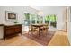 Dining room featuring hardwood floors, large windows, and view to deck at 219 W Columbia Pl, Chapel Hill, NC 27516
