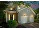 Charming two-story home featuring a two-car garage, welcoming porch, and manicured landscaping at 219 W Columbia Pl, Chapel Hill, NC 27516