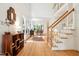 Open foyer featuring hardwood floors, a staircase and views into the living spaces at 219 W Columbia Pl, Chapel Hill, NC 27516