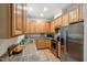 Bright kitchen with light wood cabinets, granite countertops, stainless steel appliances and a view of the breakfast area at 219 W Columbia Pl, Chapel Hill, NC 27516