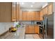 Charming kitchen with light wood cabinets, granite countertops, and stainless steel appliances at 219 W Columbia Pl, Chapel Hill, NC 27516