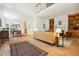 Spacious living room with hardwood floors, fireplace and open dining area at 219 W Columbia Pl, Chapel Hill, NC 27516