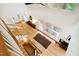 Bright living room with hardwood floors, large windows, and a modern staircase at 219 W Columbia Pl, Chapel Hill, NC 27516