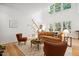 Bright and airy living room featuring vaulted ceiling, hardwood floors, and comfortable seating at 219 W Columbia Pl, Chapel Hill, NC 27516
