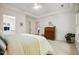 Spacious main bedroom with a tray ceiling, ensuite bath, and warm natural light at 219 W Columbia Pl, Chapel Hill, NC 27516