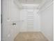 Spacious walk-in closet with wire shelving offering ample storage in a clean, white interior at 219 W Columbia Pl, Chapel Hill, NC 27516