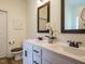 Bathroom features double sink vanity with modern fixtures and a decorative mirror at 221 Stella Way, Cameron, NC 28326