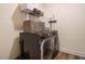 Modern laundry room with gray washer and dryer, shelving, and hard wood style flooring at 221 Stella Way, Cameron, NC 28326