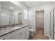 Bathroom featuring granite countertops, white cabinets, and a glass shower with natural light at 224 Ivy Bank Dr, Angier, NC 27501