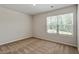 Neutral bedroom with light walls and carpet featuring a bright window at 224 Ivy Bank Dr, Angier, NC 27501