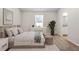 Bright bedroom featuring neutral decor, plush carpeting, and ensuite bathroom access at 224 Ivy Bank Dr, Angier, NC 27501
