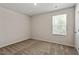 Neutral bedroom with light walls and carpet featuring a bright window at 224 Ivy Bank Dr, Angier, NC 27501