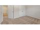 Bedroom with neutral carpet, adjacent bathroom, and double door closet at 224 Ivy Bank Dr, Angier, NC 27501
