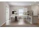 Eat-in kitchen features granite countertop bar, modern stools, and dining area at 224 Ivy Bank Dr, Angier, NC 27501
