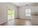 Sunny dining area featuring sliding glass doors to the backyard and wood flooring at 224 Ivy Bank Dr, Angier, NC 27501