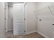 Bright laundry room features wire rack shelving and ample space at 224 Ivy Bank Dr, Angier, NC 27501