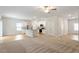 Open-concept living room and kitchen with modern appliances and a large island at 224 Ivy Bank Dr, Angier, NC 27501