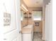 Neutral bathroom with a tile countertop sink and a decorative floral arrangement at 233 Pressly Foushee Rd, Sanford, NC 27330