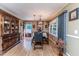 Elegant dining room with hardwood floors, chandelier lighting, a china cabinet, and stylish decor at 233 Pressly Foushee Rd, Sanford, NC 27330