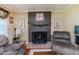 Close up view of a brick fireplace, complete with decorative accents and comfortable armchairs, perfect for relaxation at 233 Pressly Foushee Rd, Sanford, NC 27330
