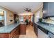 Open kitchen layout showcasing a granite countertop island, adjacent to the dining area and living spaces at 233 Pressly Foushee Rd, Sanford, NC 27330