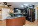 Modern kitchen featuring a center island with granite countertops, stainless steel appliances, and ample cabinet space at 233 Pressly Foushee Rd, Sanford, NC 27330