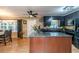 Well-equipped kitchen with dark cabinetry, granite countertops, a kitchen island, and stainless steel appliances at 233 Pressly Foushee Rd, Sanford, NC 27330