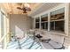 Enclosed sunroom with comfortable seating and relaxing ambiance at 233 Pressly Foushee Rd, Sanford, NC 27330