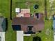 Aerial view of a well-maintained home featuring solar panels and a cozy backyard setup at 236 Emma Ct, Linden, NC 28356