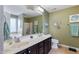 This bathroom features double sinks and vanities, framed mirrors, and tile flooring at 236 Emma Ct, Linden, NC 28356