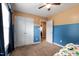 This bedroom contains neutral carpet, a ceiling fan, a window, and a closet at 236 Emma Ct, Linden, NC 28356