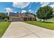 Charming two-story home with a well-manicured lawn, solar panels, and a spacious two-car garage at 236 Emma Ct, Linden, NC 28356
