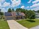 Charming two-story home with a well-manicured lawn, solar panels, and a spacious two-car garage at 236 Emma Ct, Linden, NC 28356