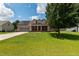 Charming two-story home with a well-manicured lawn, solar panels, and a spacious two-car garage at 236 Emma Ct, Linden, NC 28356