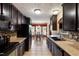 This kitchen has granite countertops, dark wood cabinetry, and stainless appliances, plus an eat-in area at 236 Emma Ct, Linden, NC 28356