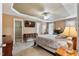 Spacious main bedroom boasts a ceiling fan, ensuite bathroom, and a walk-in closet at 236 Emma Ct, Linden, NC 28356